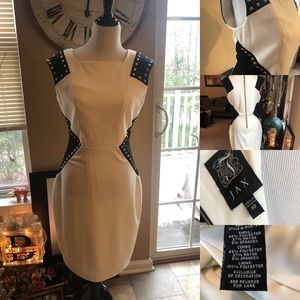 Gorgeous figure enhancing dress with gold studs.